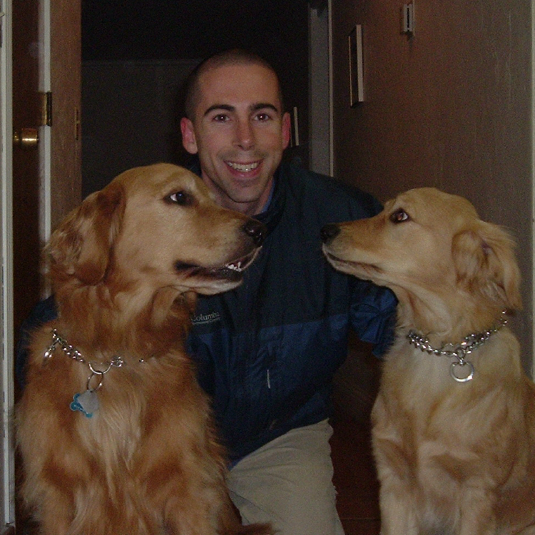 Joe with golden retriever sisters Gravity and Maybe, 2008